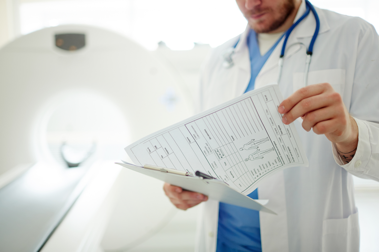 Doctor examining medical record of the patient